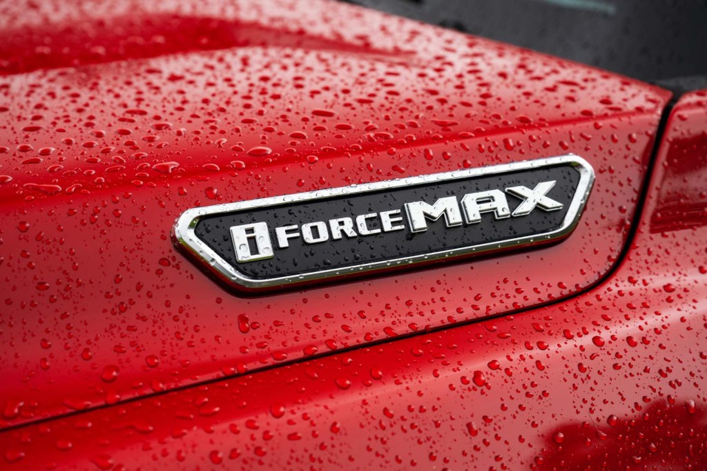 The i-Force MAX engine badging on a red 2024 Toyota Tacoma. 
