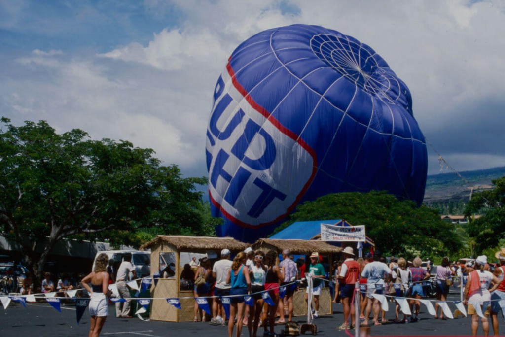 Bud Light hot air balloon deflating in a crowd