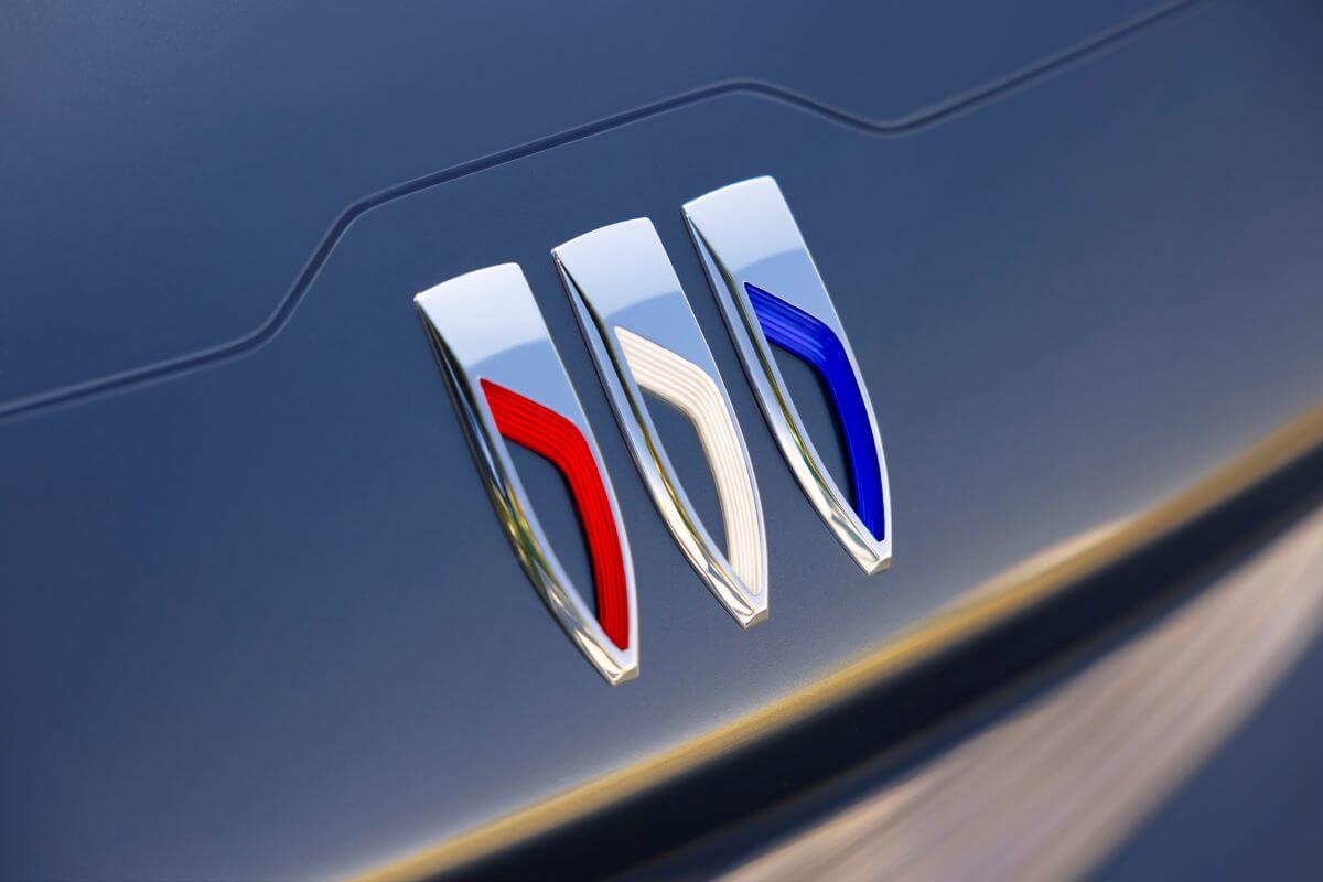 The new tri-shield Buick logo and emblem mounted on the body of the Wildcat EV concept vehicle, The new Buick brand might help it sell more models.