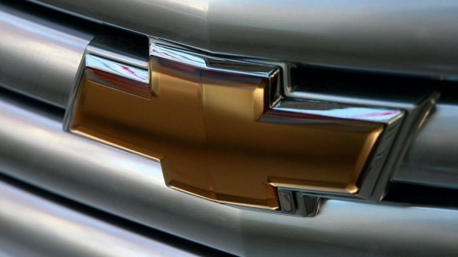 A close up of the Chevy Bowtie logo on a car.