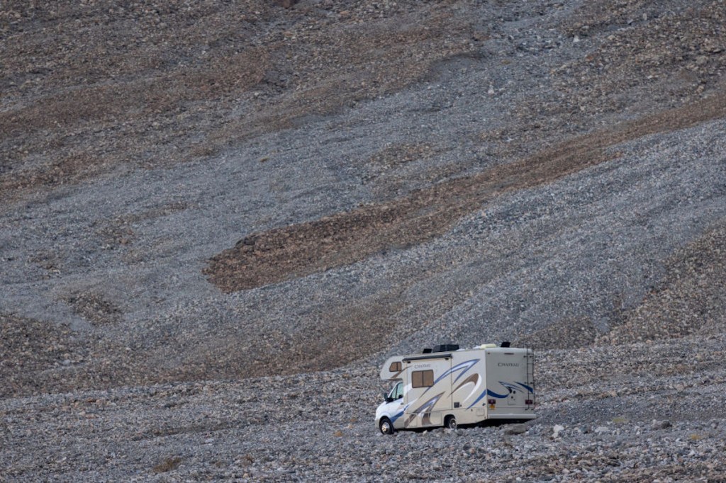 RV is desolate location with hills behind