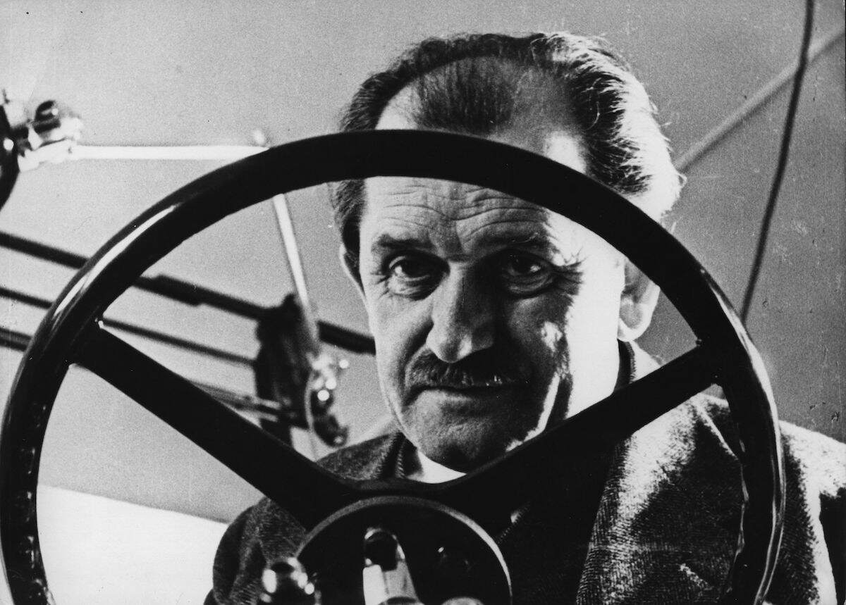 Ferdinand Porsche (1875–1951), the designer of the first hybrid car, behind the wheel of one of his creations
