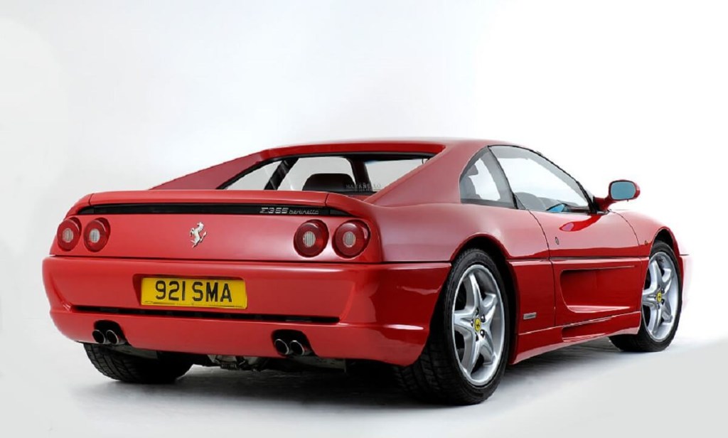 A used Ferrari F355 shows off its new number plate and rear-end styling. 
