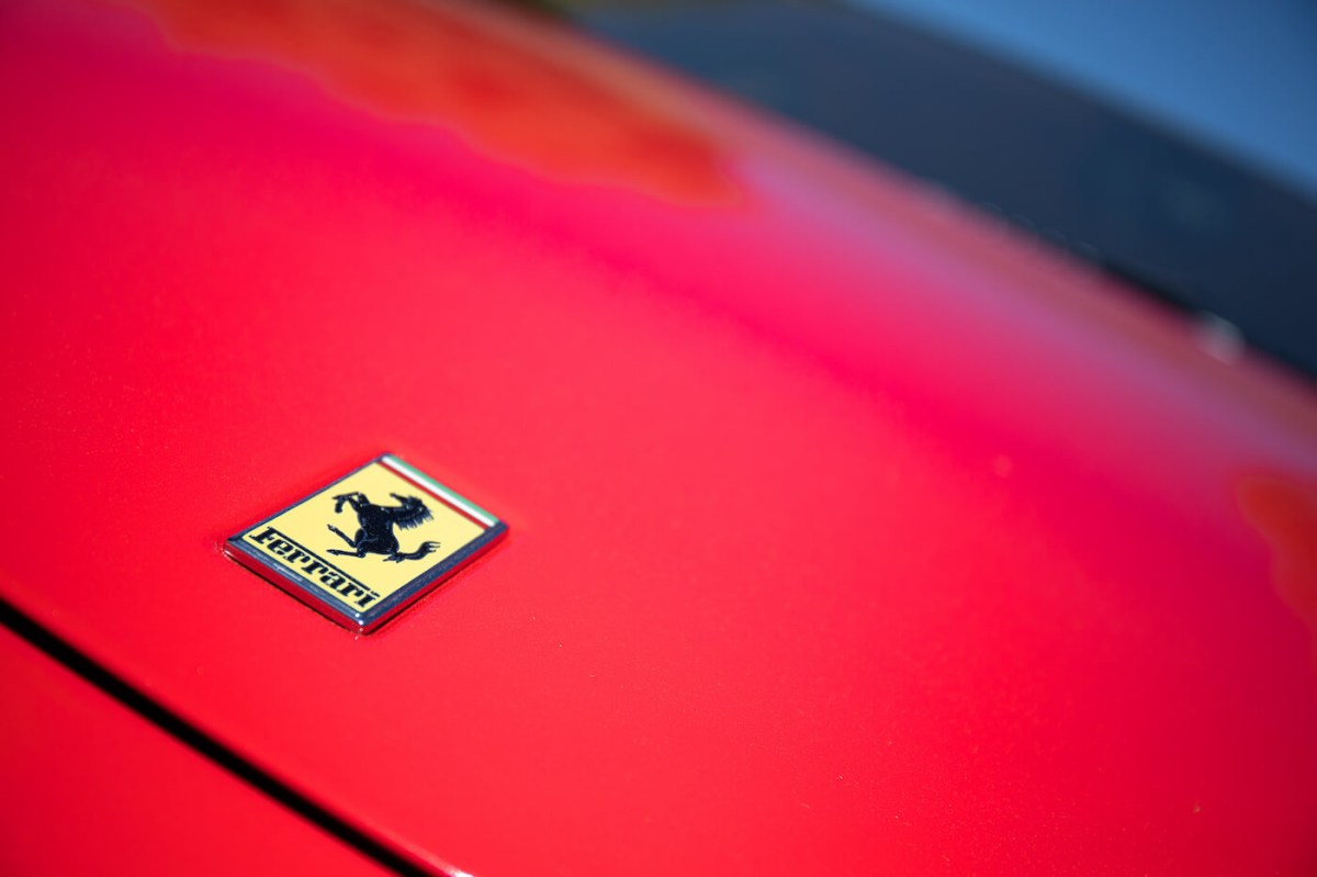 Logo of a red Ferrari car at the second edition of the Autopia Fair