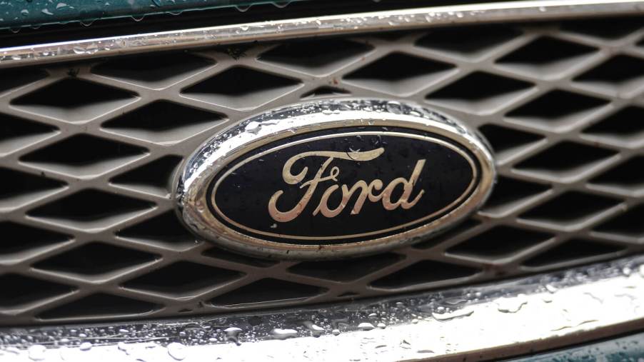 A Ford logo on the front grille of a car.
