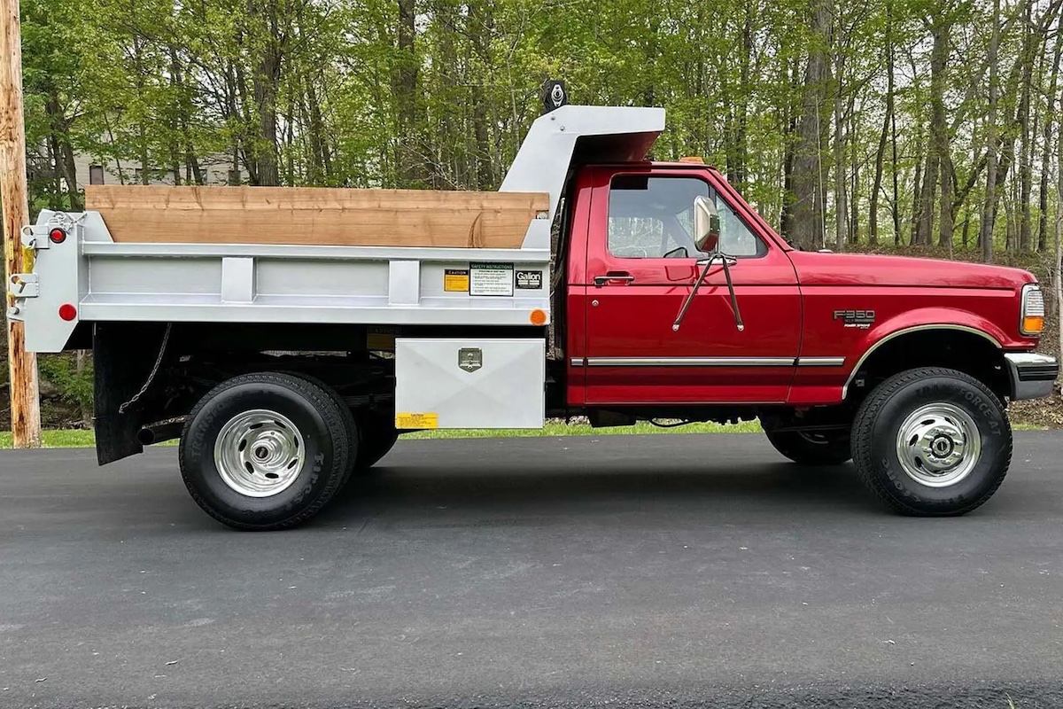 Vintage Ford dump truck in profile