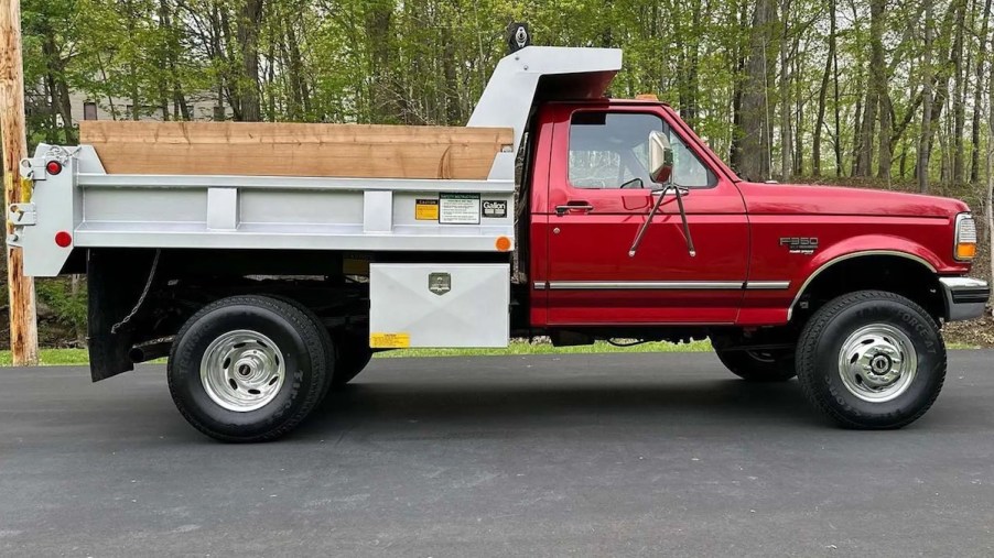 Vintage Ford dump truck in profile