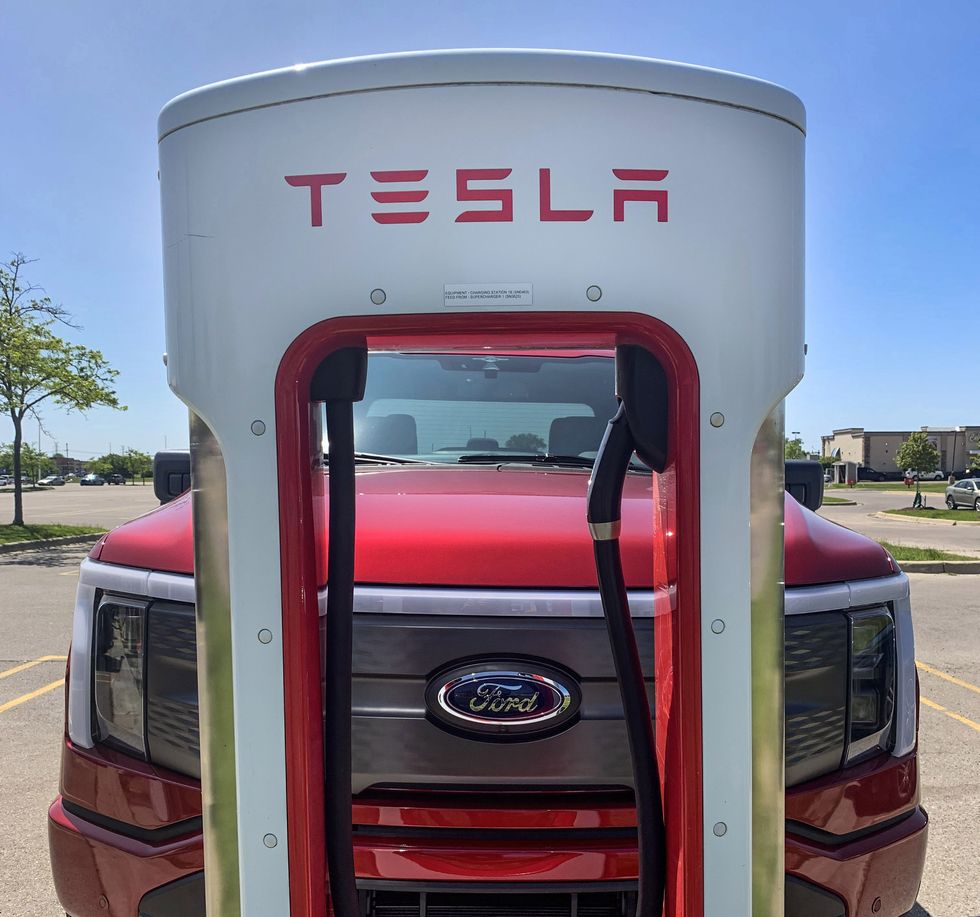 The 2023 Ford F-150 using a Tesla fast charger