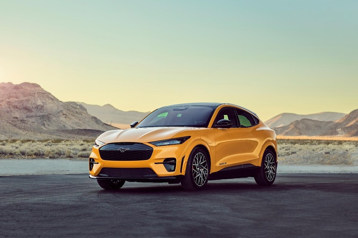 A bright yellow 2023 Ford Mustang Mach-E Performance Edition shows off its fascia.