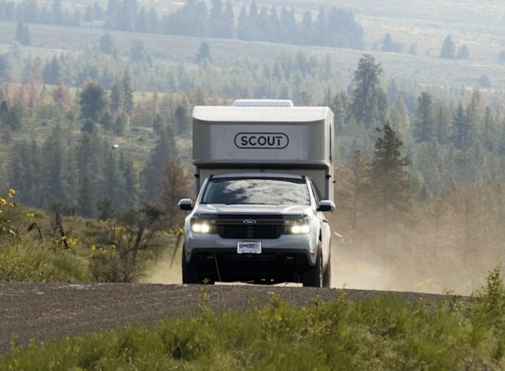 The 2023 Ford Maverick with the Scout Tuktut camper on the road