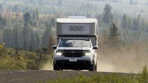 The 2023 Ford Maverick with the Scout Tuktut camper on the road