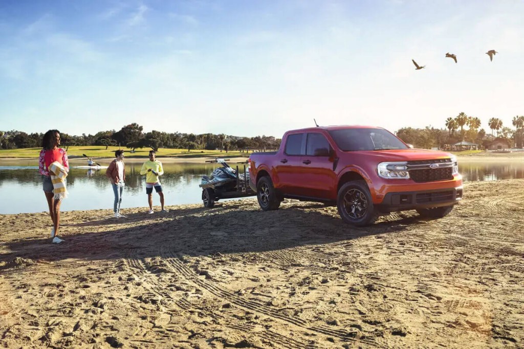 A Ford Maverick pulls a boat out of the water.