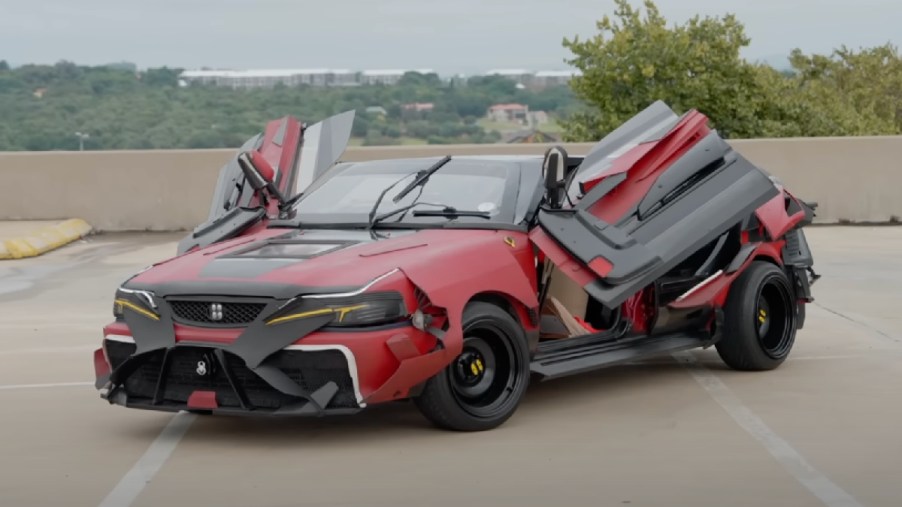 Front angle view of modified Toyota Corolla "Tazzla" that looks like Tesla Model X Transformers robot car