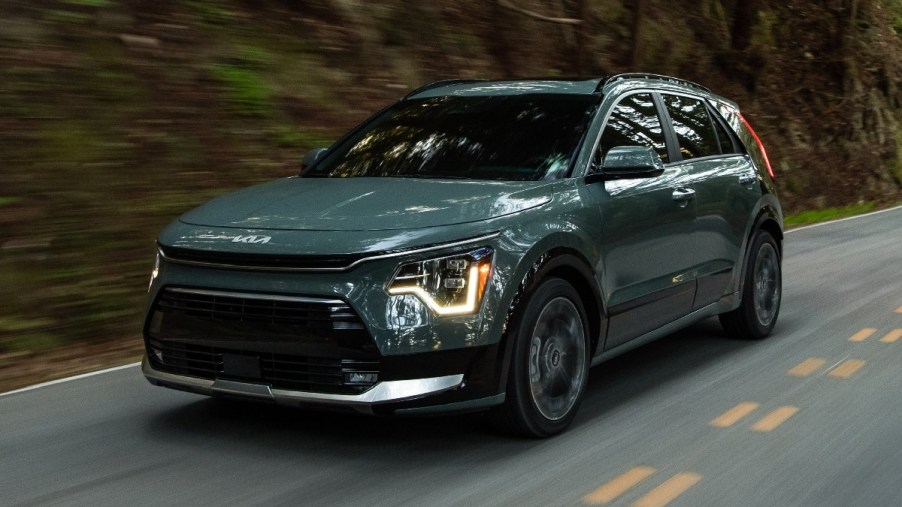 Front angle view of green 2023 Kia Niro, cheapest new hybrid SUV and best gas mileage for SUV