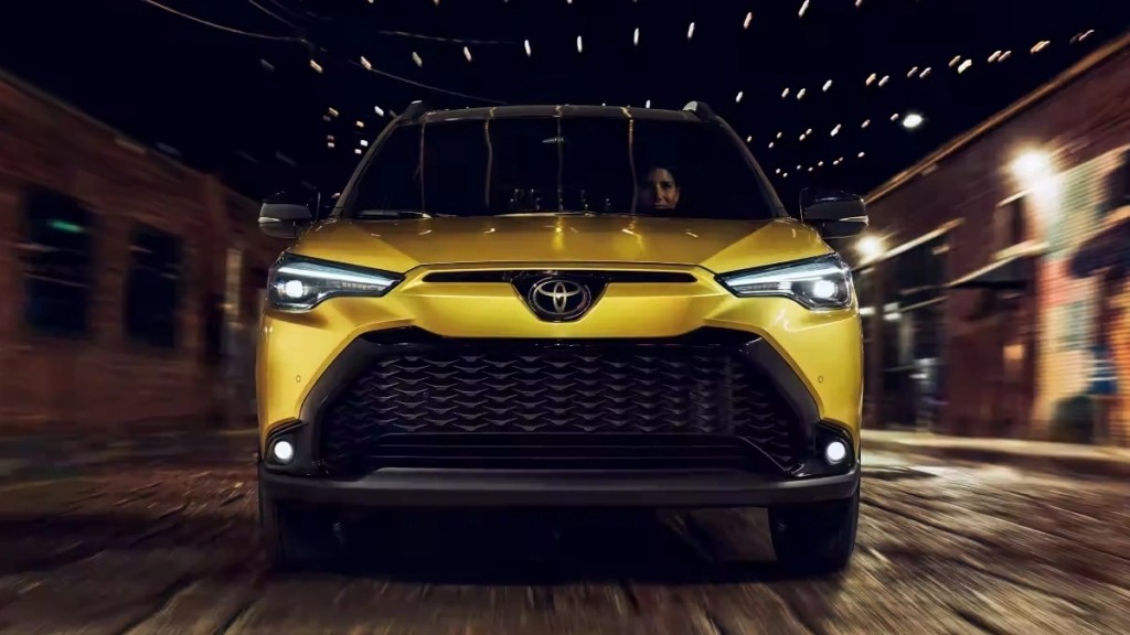 Front view of yellow 2023 Toyota Corolla Cross subcompact crossover SUV