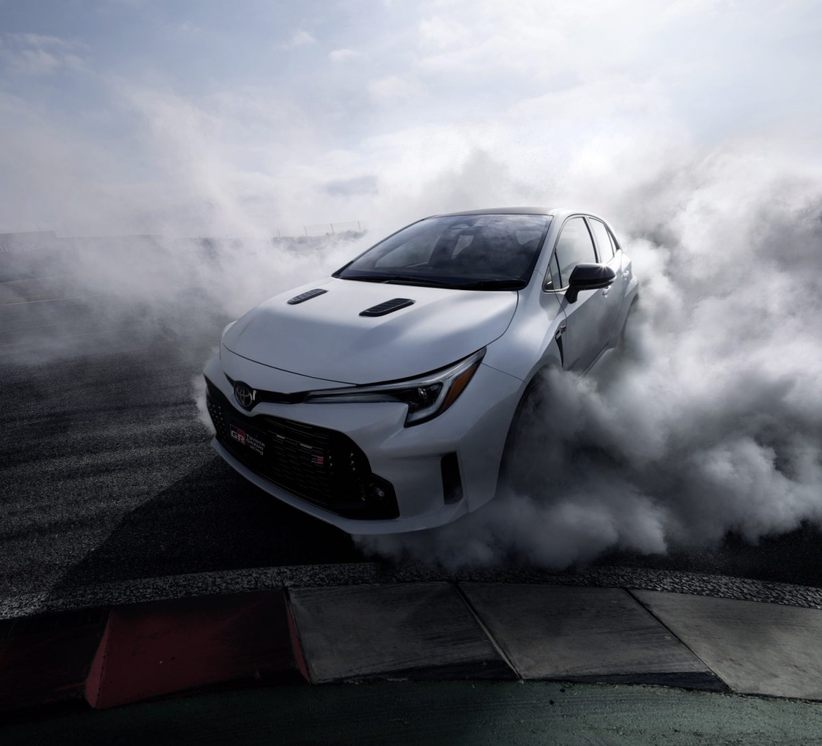 A white Toyota GR Corolla doing a burnout proves that Toyota is one of the coolest car companies.