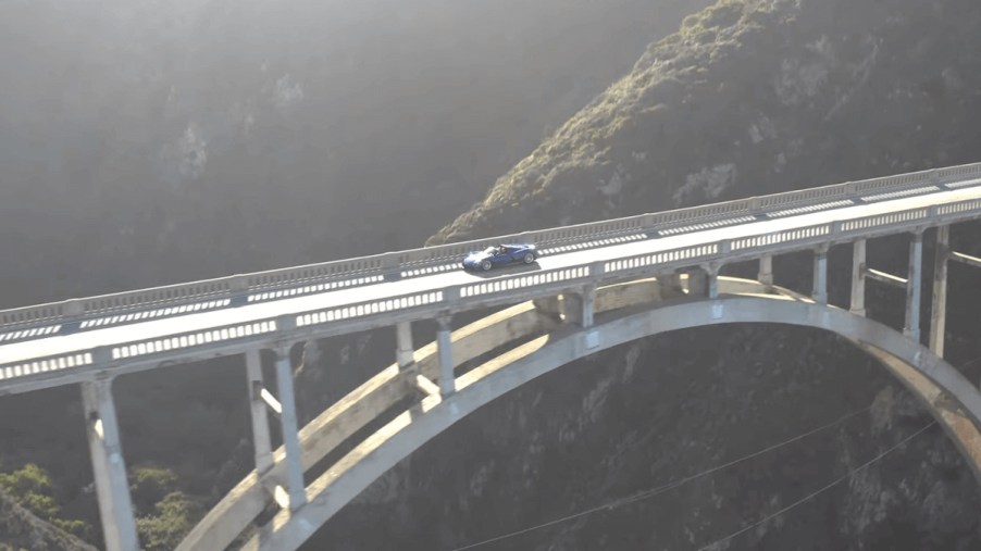 Hennessey Venom F5 Roadster crossing a bridge.