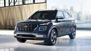 A blue 2023 Hyundai Venue Limited is parked.