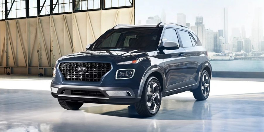A blue 2023 Hyundai Venue Limited is parked.