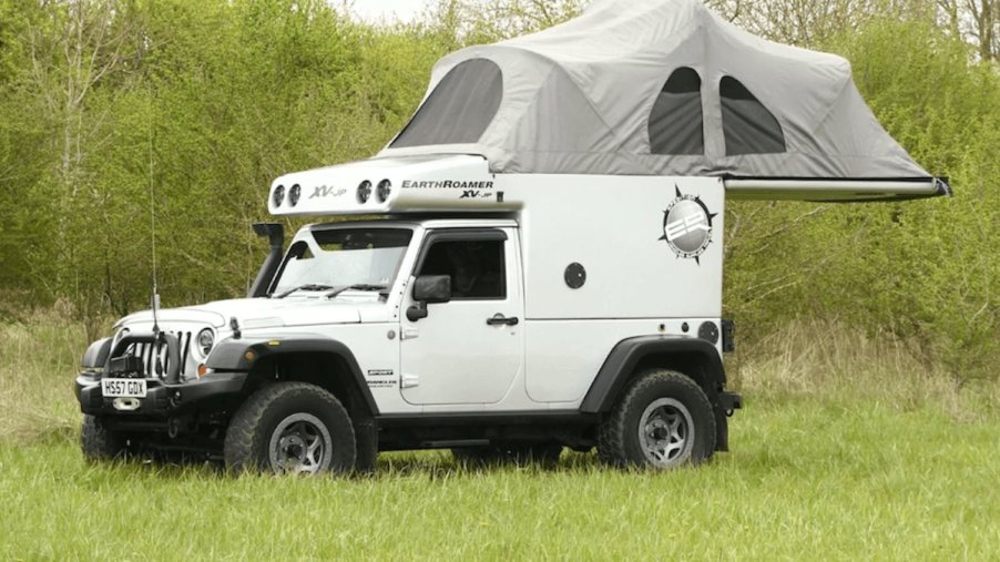 The roof tent unfolded showing the camp setup of the Jeep Wrangler camper.