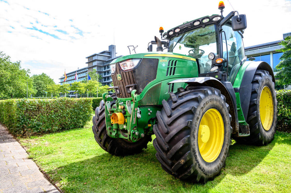 John Deere ROPS on a tractor sitting on grass