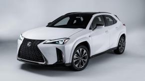 A white 2023 Lexus UX against a white/silver background