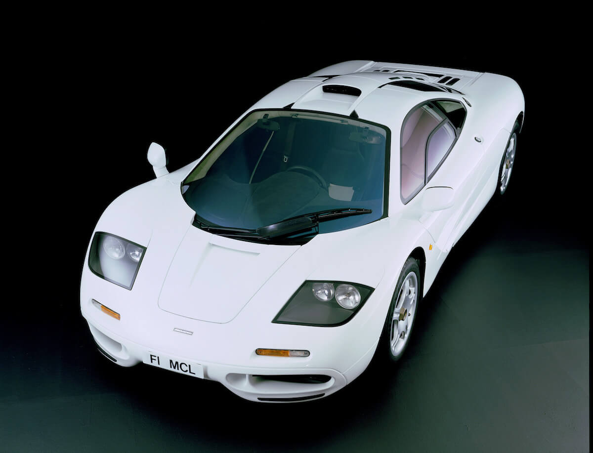 A white McLaren F1 in a studio