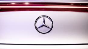 The Mercedes-Benz logo on an EQS model at the Daimler AG stand during IAA Mobility in Bavaria, Munich, Germany