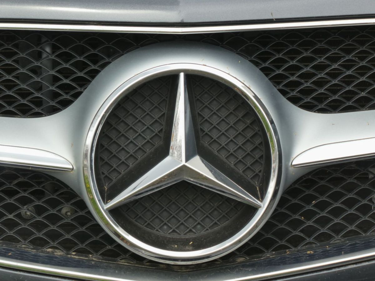 A Mercedes logo on the front of a grille.