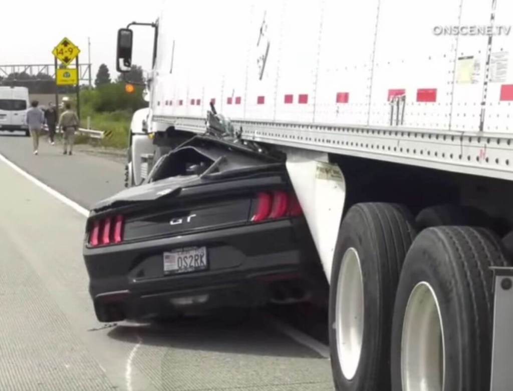 Mustang GT versus tractor-trailer 