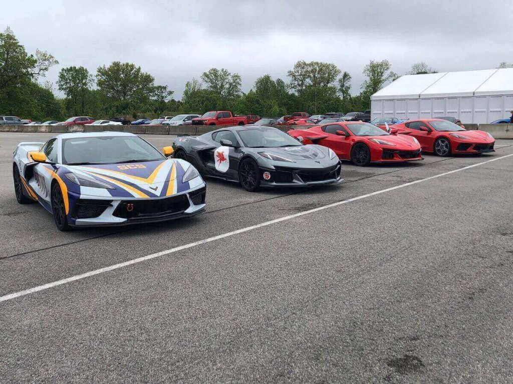 C8 Corvette Stingrays and Z06s stage before driving with reckless enthusiasm on a closed track. 