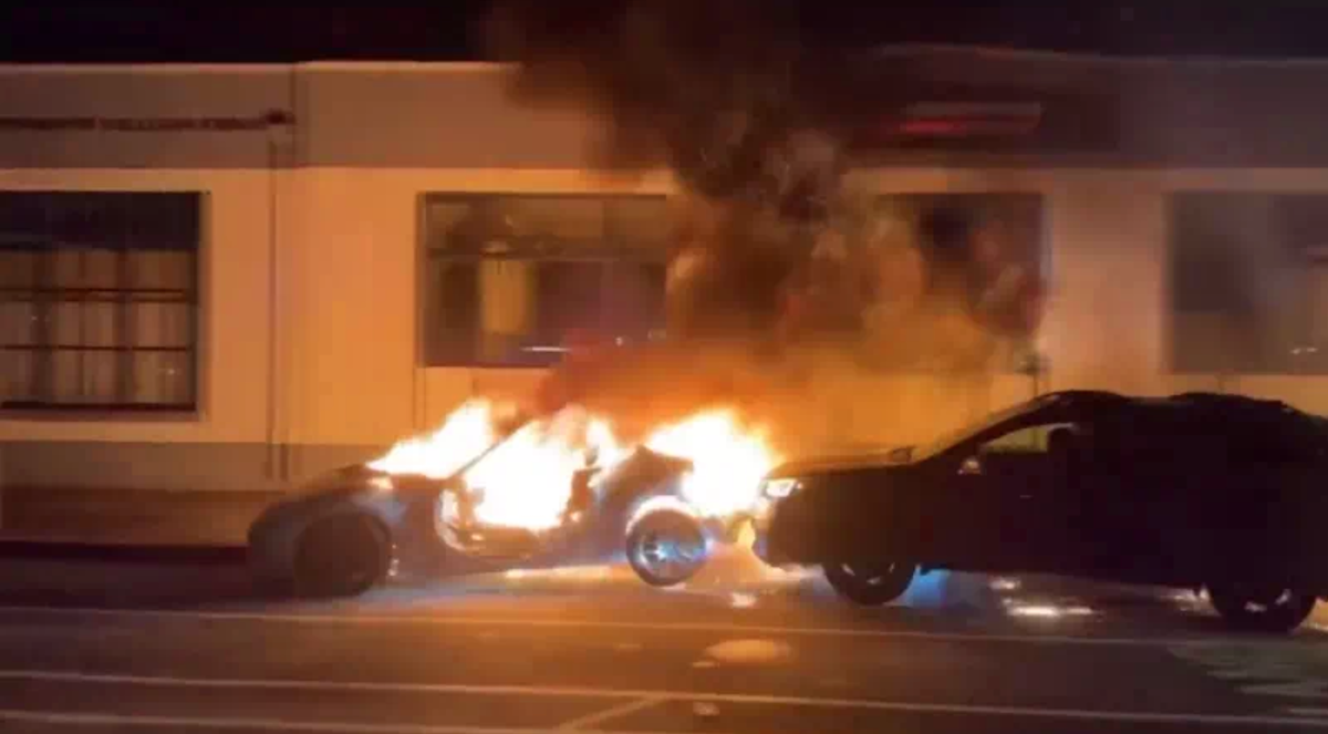 Oakland street takeover ends in burning Nissan 370Z getting rammed by a Subaru Outback.