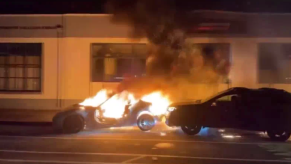 Oakland street takeover ends in burning Nissan 370Z getting rammed by a Subaru Outback.
