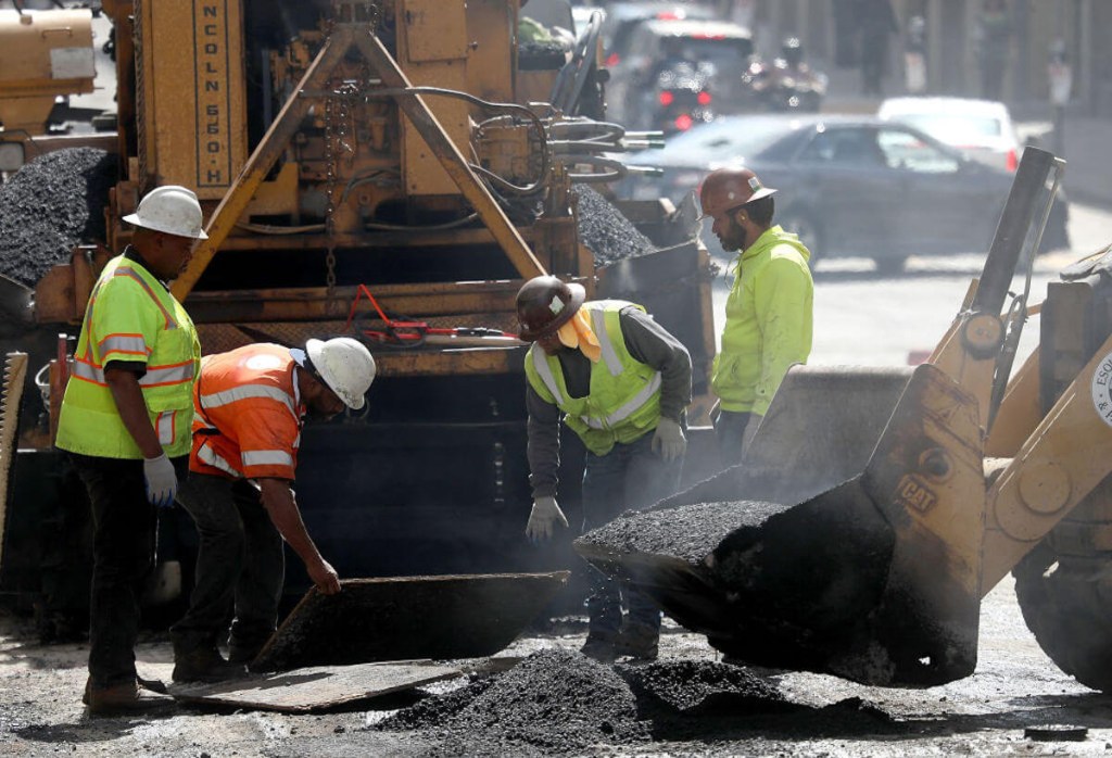 Workers paving roads in Florida