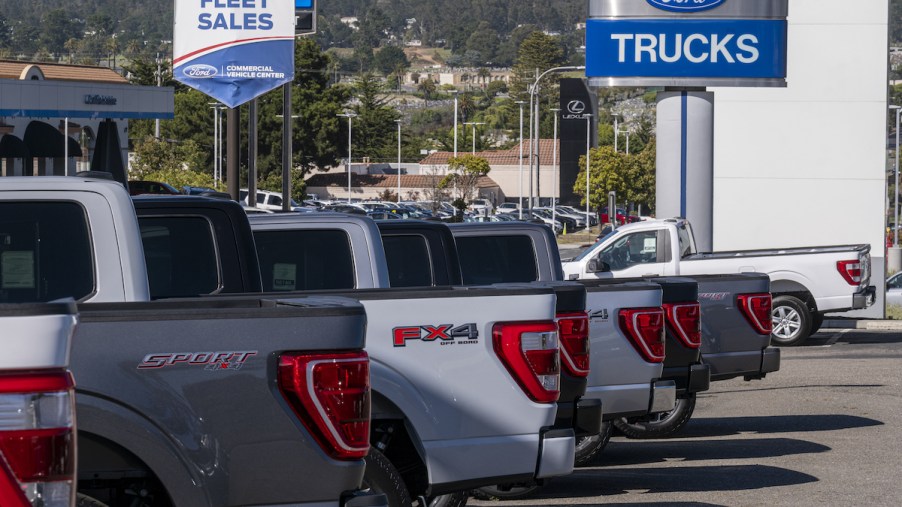 A Ford Motor Dealership parking lot full of trucks