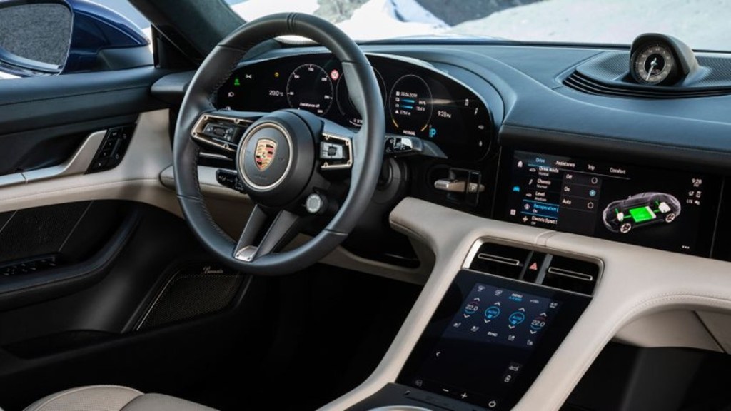 Porsche Taycan Interior - Notice the two-tone look and electronic features built into traditional locations