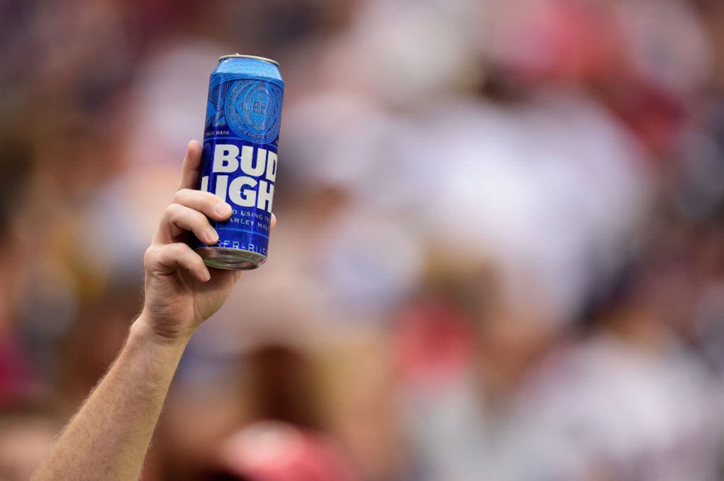 A raised can of Bud Light 