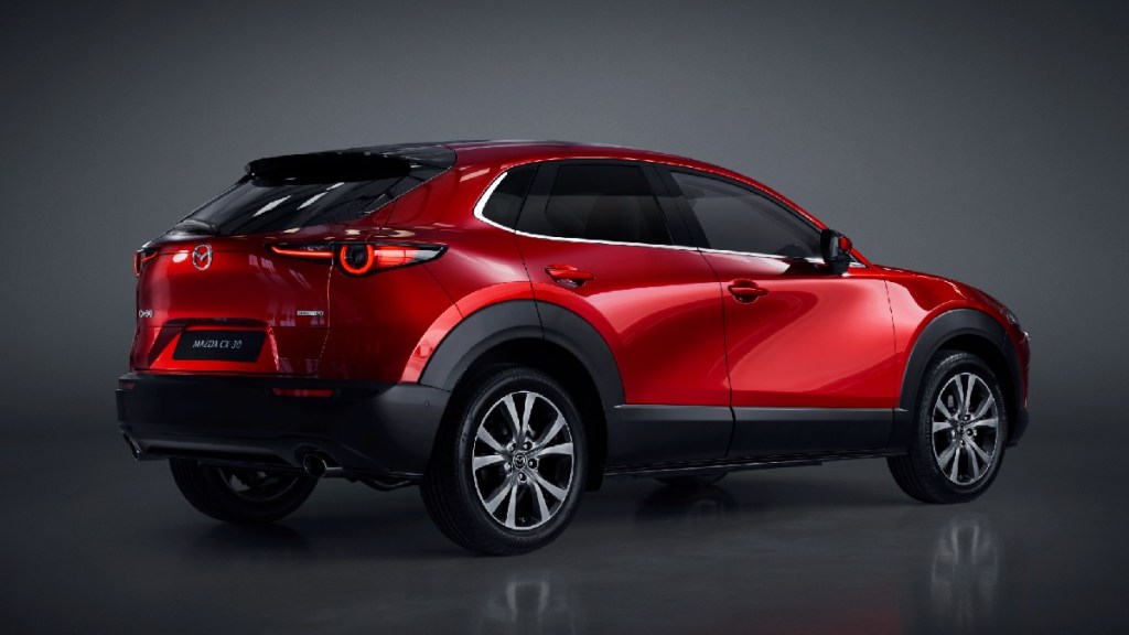 Rear angle view of red 2023 Mazda CX-30, most affordable new all-wheel SUV, costs $23K and is best in class