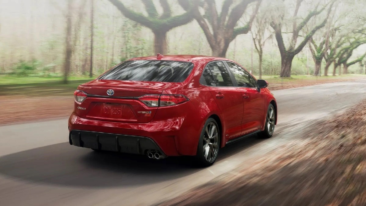 Rear angle view of red 2023 Toyota Corolla compact car