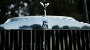 The front grille of a Rolls-Royce luxury car.