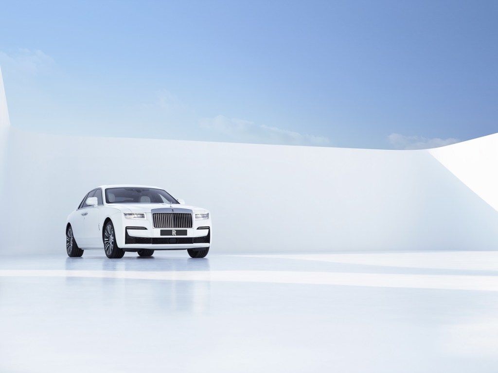 A white Rolls-Royce Ghost poses against a white backdrop.