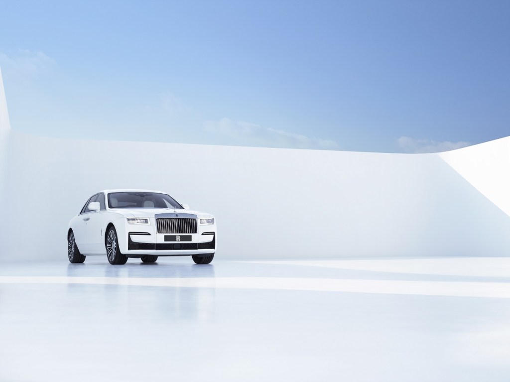A white Rolls-Royce Ghost poses against a white backdrop. 