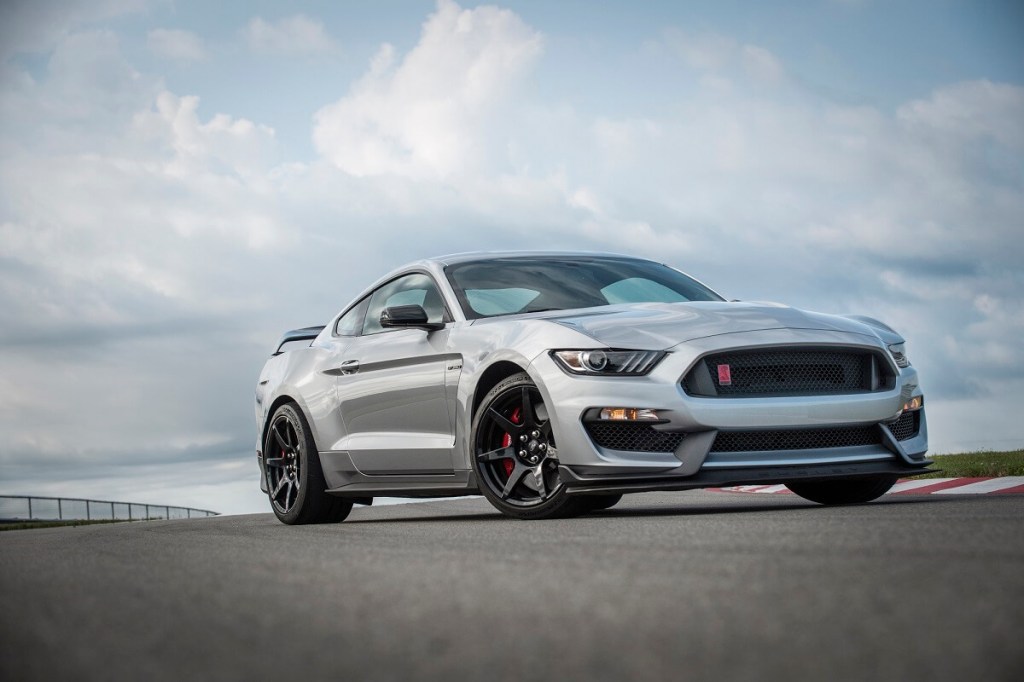 A silver Ford Mustang Shelby GT350 shows off its track-ready muscle car fascia.