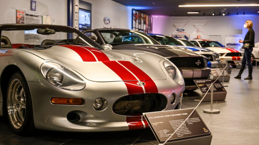 A silver Shelby Series1 in a museum