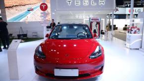 A red Tesla Model 3 luxury electric compact car at the 2022 China International Fair for Trade in Services (CIFTIS)