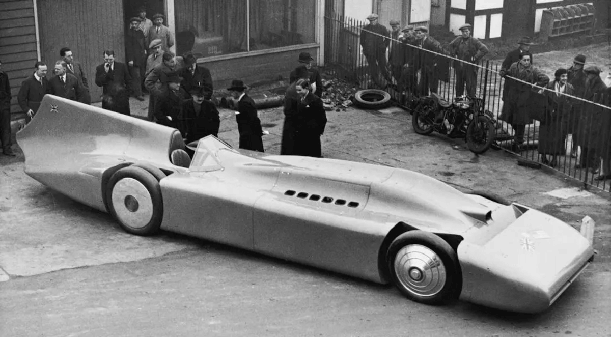 A black and white picture of the Blue Bird, the first car to ever go 300 mph.