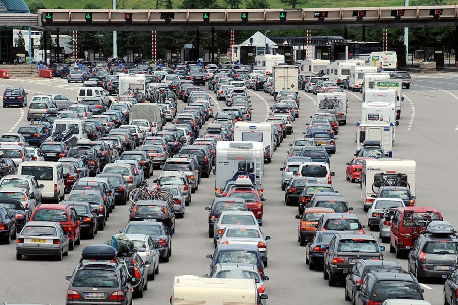 Lines of cars and trucks waiting at toll booths