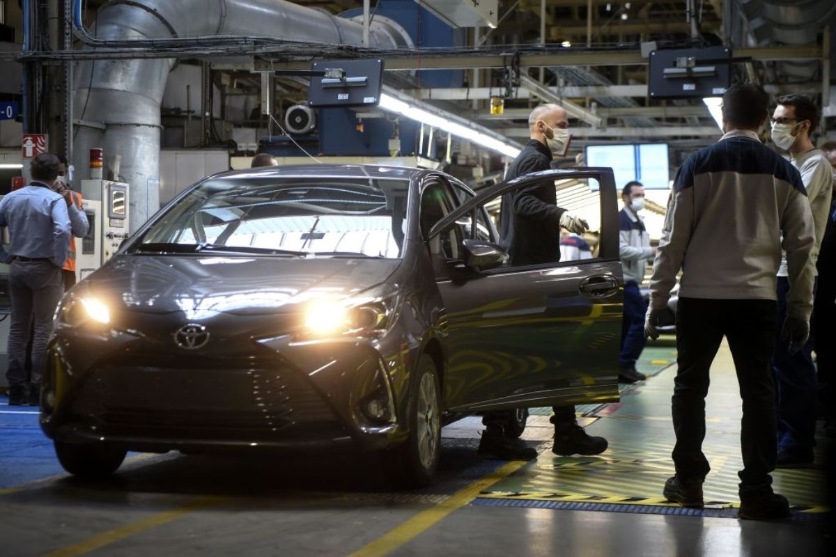 A Toyota car in an factory gets a safety inspection.