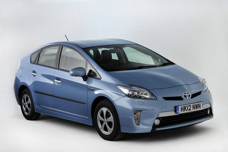 A used Toyota Prius hybrid model sits on its lithium replacement battery pack for a photoshoot. 