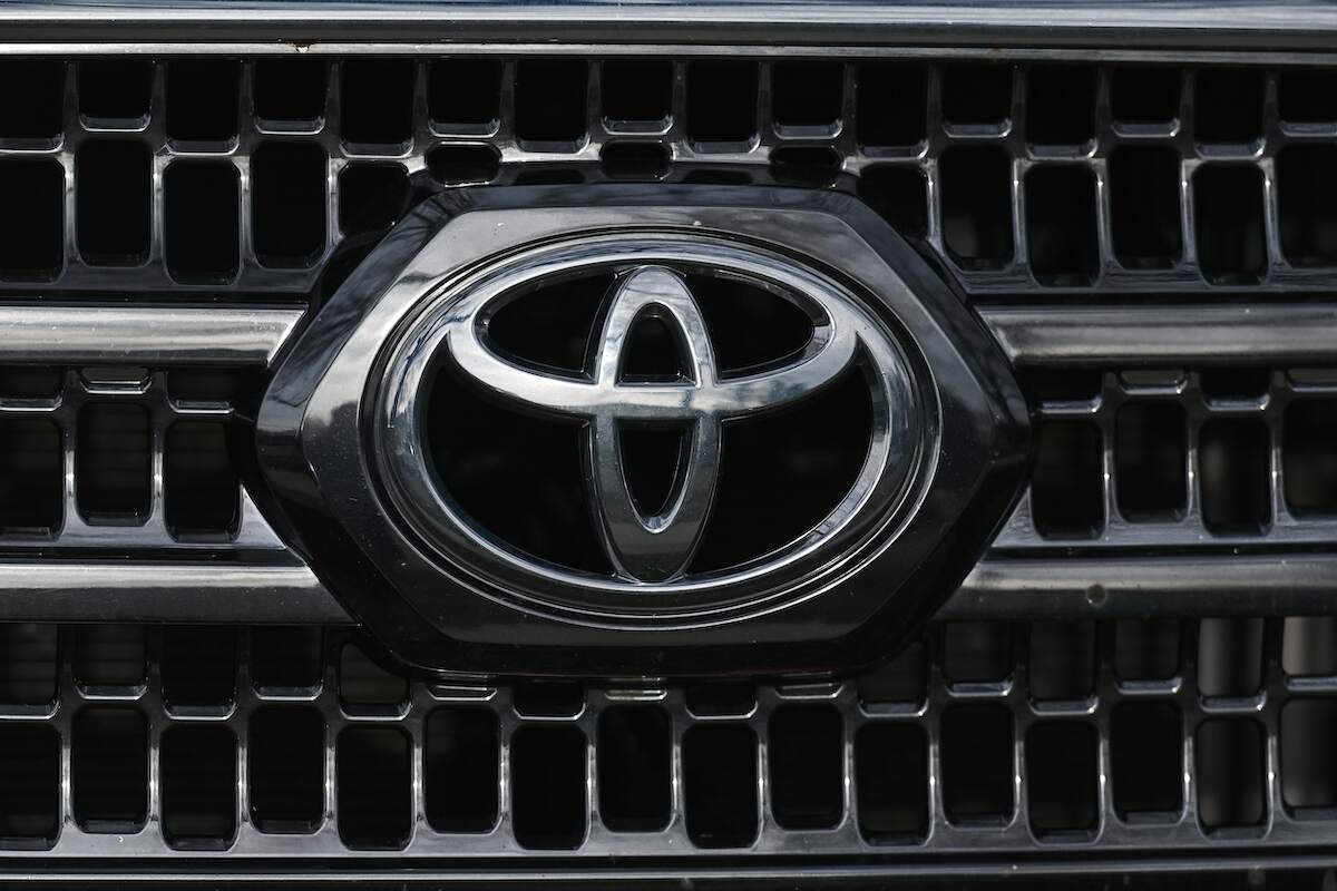 A silver Toyota logo on the grille of a car